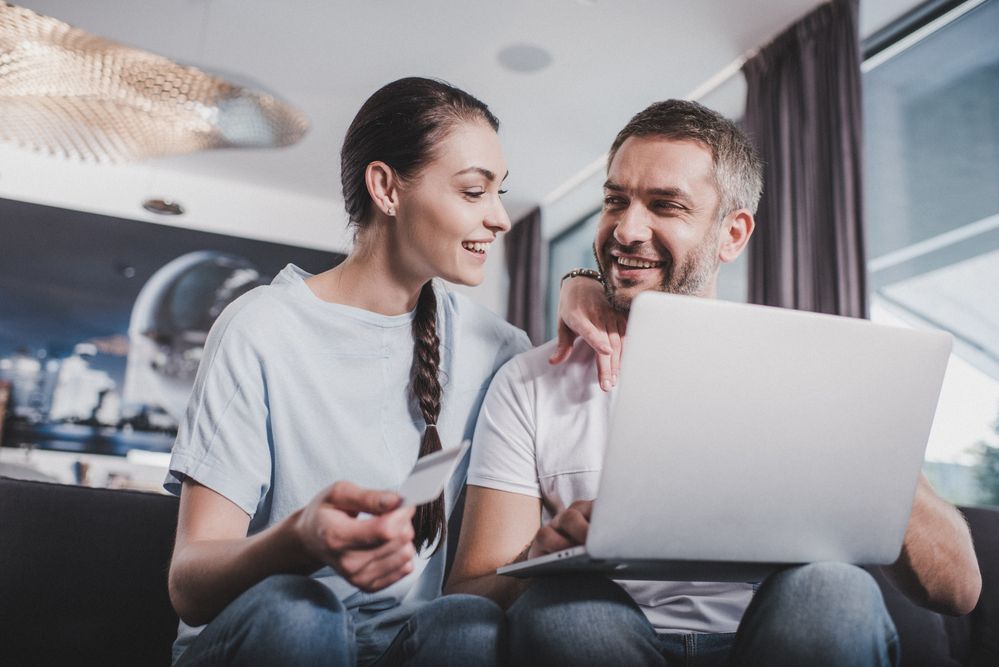 Couple talking while shopping online